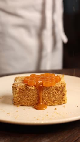 chef preparing a honeycomb caramel cake