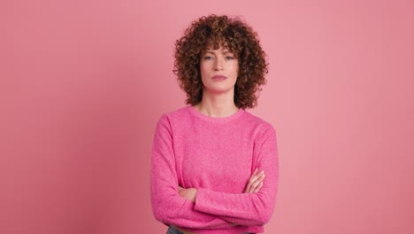 disagreeing young woman shaking head with twisted mouth on pink background