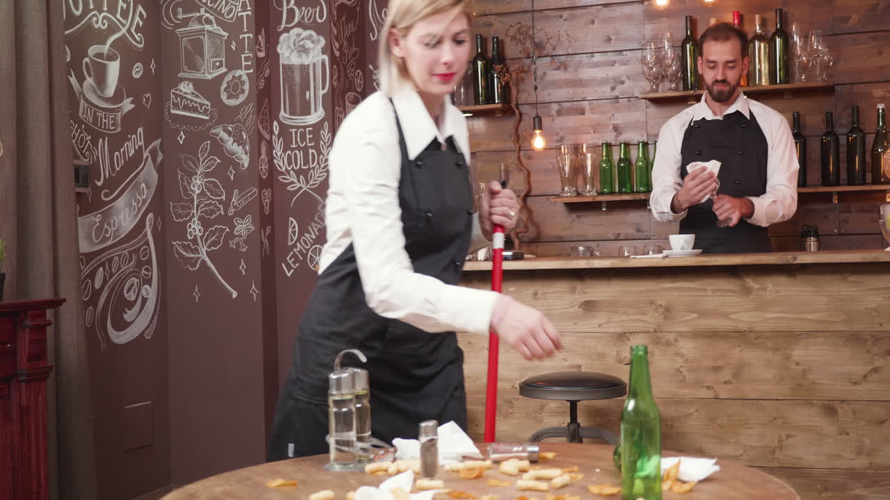 Bar Staff Cleaning the Restaurant