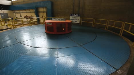 panning shot across the top of a turbine generator in a water processing facility