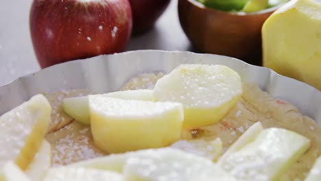 slice of apple on tart with icing sugar 4k