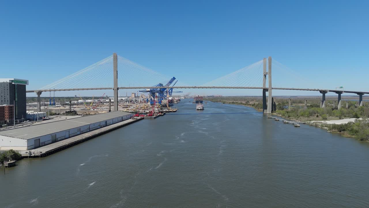 Aerial push in over the Savannah River of The Talmadge Memorial Bridge.