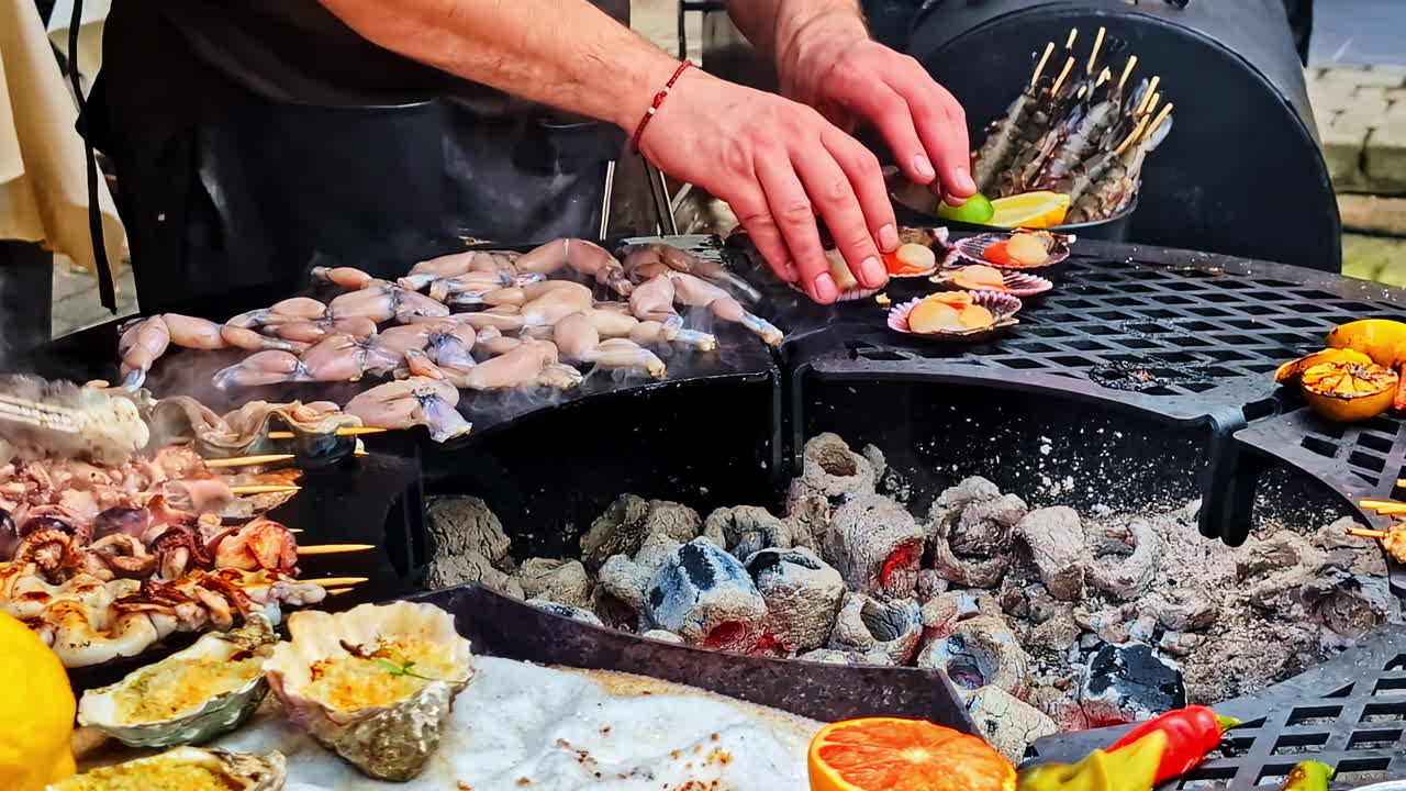 Master chef cooking delicious seafood BBQ, close up view