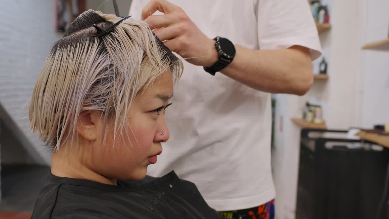 Woman getting a haircut at a salon