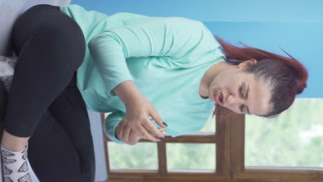 Vertical-video-of-Depressed-woman-shaking-her-head-with-negative-expression.