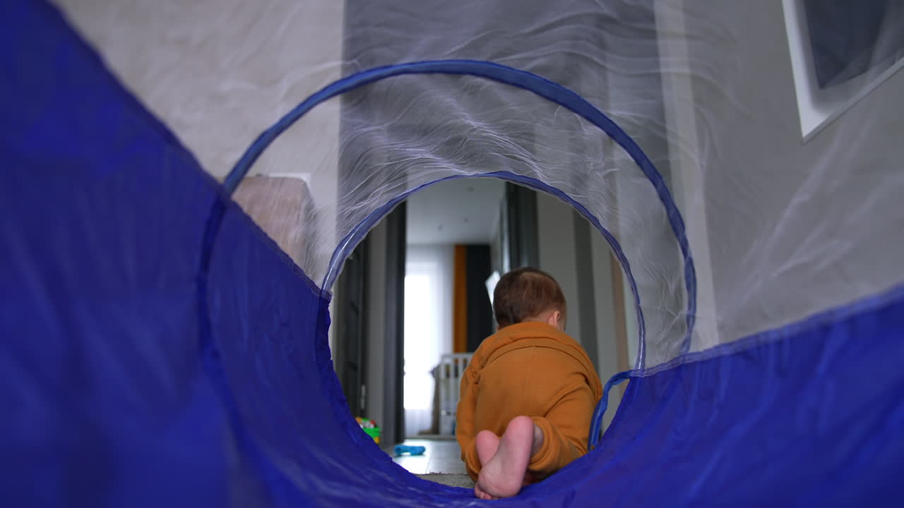 Baby Crawling Through Play Tunnel