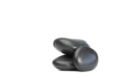 Black-pebbles-rotating-