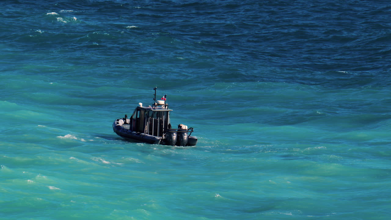 Nice, France - March 17, 2025: Small boat moving on the blue sea in daylight