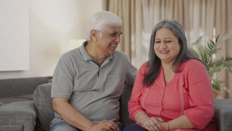 Happy-Indian-old-couple-talking-to-each-other