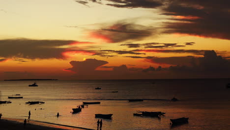 time lapse - beautiful sunset on the beach with boats, nungwi, zanzibar, tanzania