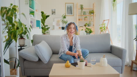 joyful woman relaxing on sofa at home