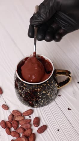 preparing a hot chocolate in a fancy mug