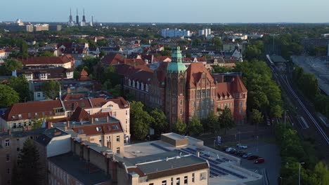 Majestic-aerial-top-view-flight-Historic-school-building-Berlin-city-Germany-in-Europe,-summer-day-2023