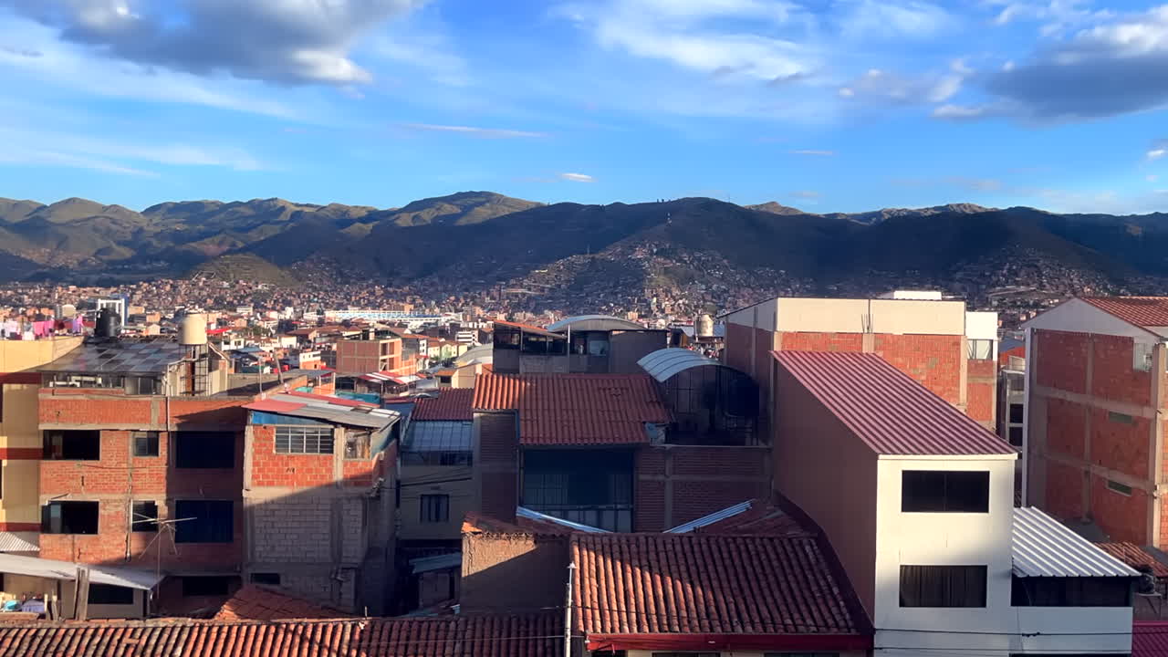 Scenic sunrise over Cusco rooftops, capturing city awakening. Time lapse