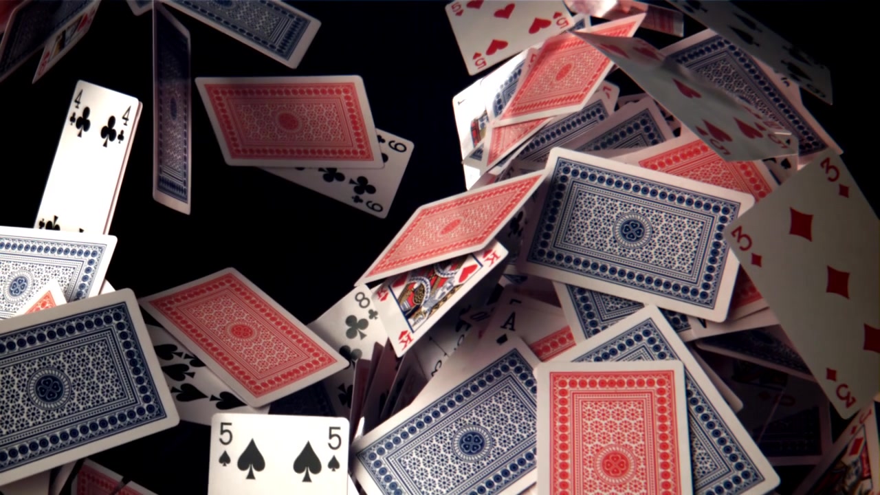 Playing Cards Falling and Floating in Slow Motion on Black Background