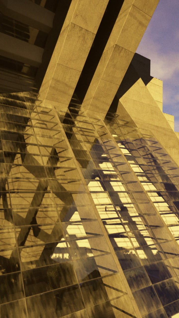 Building structure reflects light in the evening sky