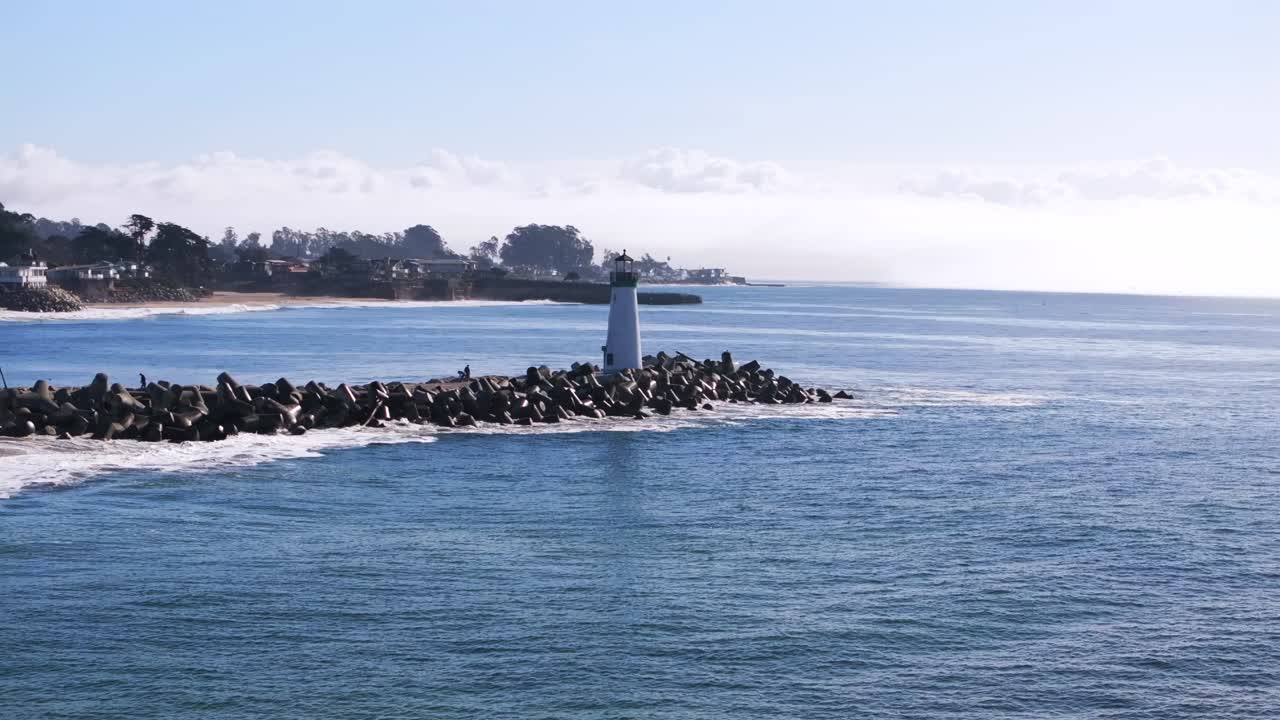 Lighthouse on the coast with people