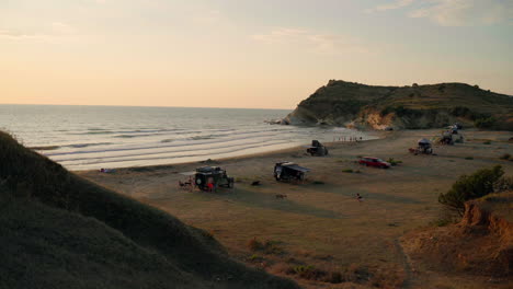 off-road vehicles parked in the sand dunes at the adriatic sea