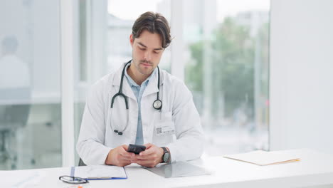 Doctor,-man-and-phone-in-office-for-communication