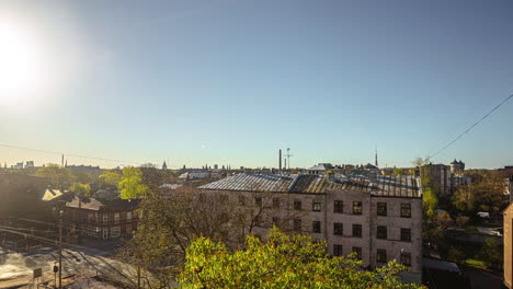 small eastern europe town street intersection on sunny day, time lapse view