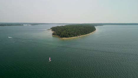 Aerial-view-of-windsurfer-on-lake-Huron,-Les-Cheneaux-Islands,-Michigan