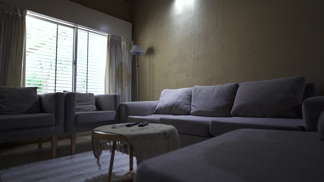 Relaxed glide reveals inviting lounge area with seating and functional center table. Ideal for showcasing rental listings for comfort and layout.