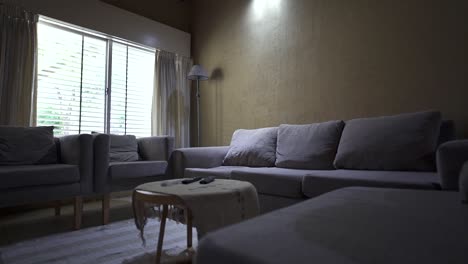 relaxed glide reveals inviting lounge area with seating and functional center table. ideal for showcasing rental listings for comfort and layout.