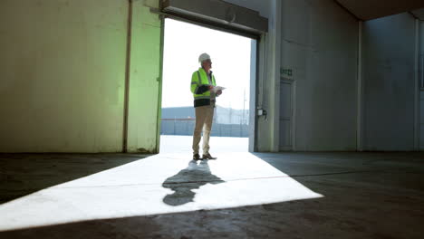 construction worker inspecting warehouse