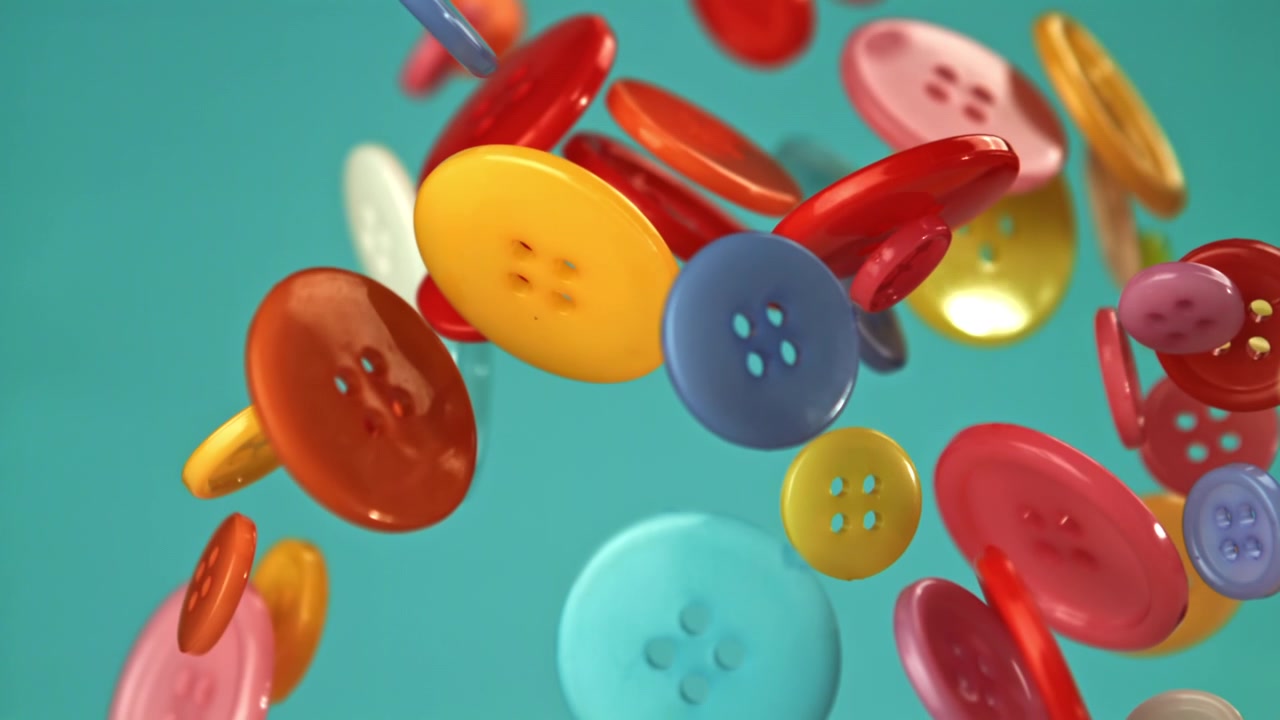 Bottoni da cucito vivaci e colorati che cadono al rallentatore