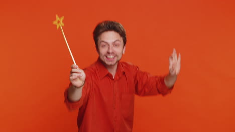 magician wizard young man gesturing with magic wand making wish come true casting magician spell