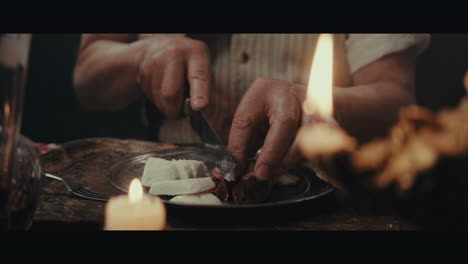 an old pirate eats and drinks inside the sailing ship cabin