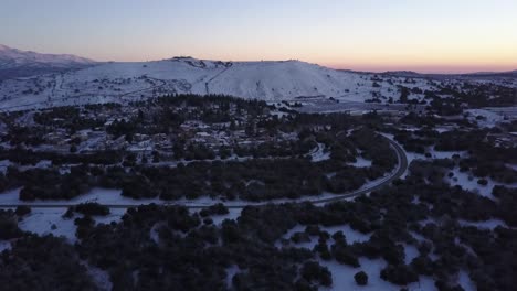 snowy mountain village at sunrise/sunset