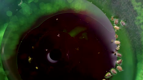 abstract dark ink spilling in green liquid background texture