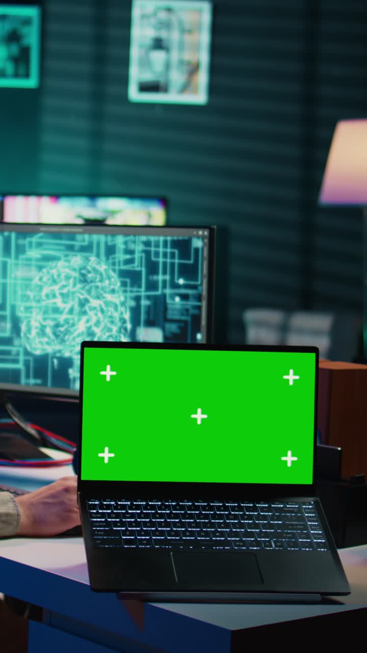 Vertical Video of Laptop with Green Screen Display in Modern Office
