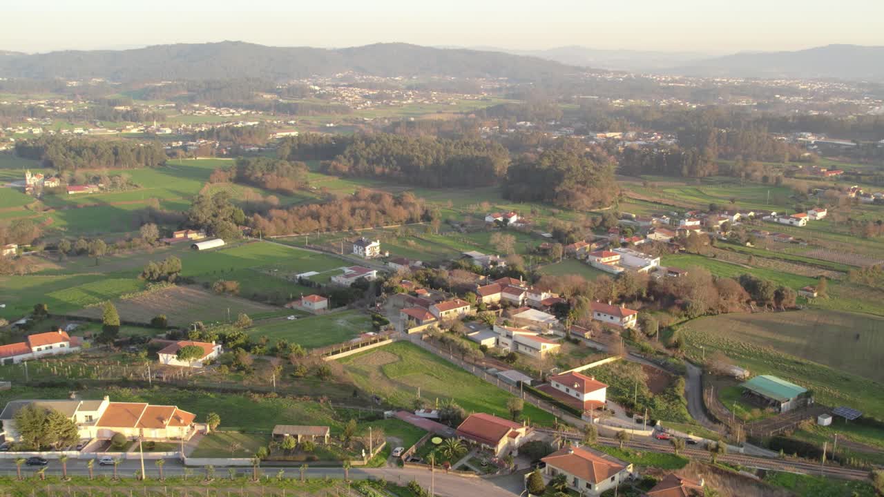 Aerial - rural landscape with vineyards, fields, and houses in Alto Minho, Portugal
