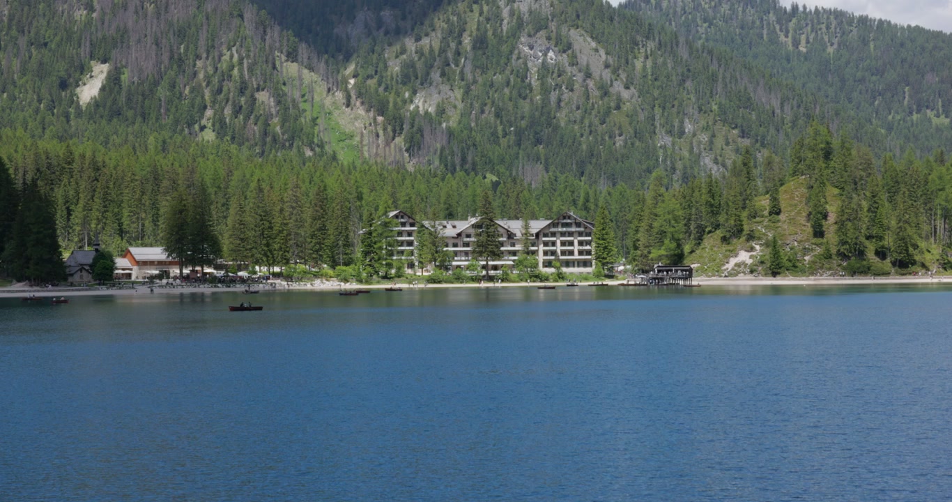 Hotel Pragser Wildsee On The Shore Of Lake Braies In The Dolomites Of South Tyrol, Italy. - wide shot