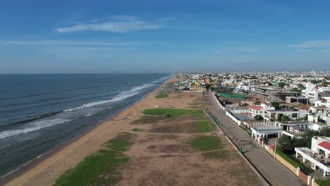 stunning aerial footage of chennai city flying over a beach and fishing boats