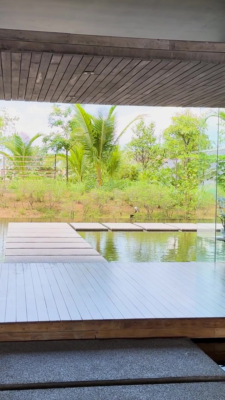 Serene resort view with water and greenery