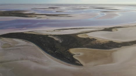 aerial shot of swirling sands of the pink lake tyrrell, vic, australia