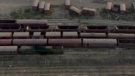 aerial top down photo of railway transportation hub showing the different trains parked next to each other on the rails