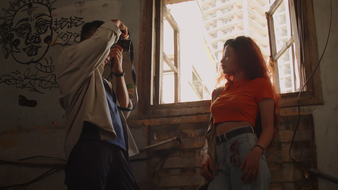 Photographer Capturing Model by Window with Cityscape
