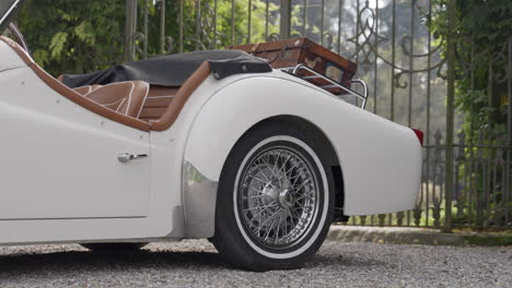 classic white convertible car with vintage luggage