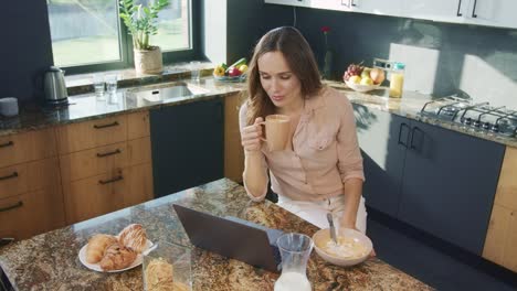 Happy-woman-talking-at-computer.-Topdown-smiling-person-having-online-chat