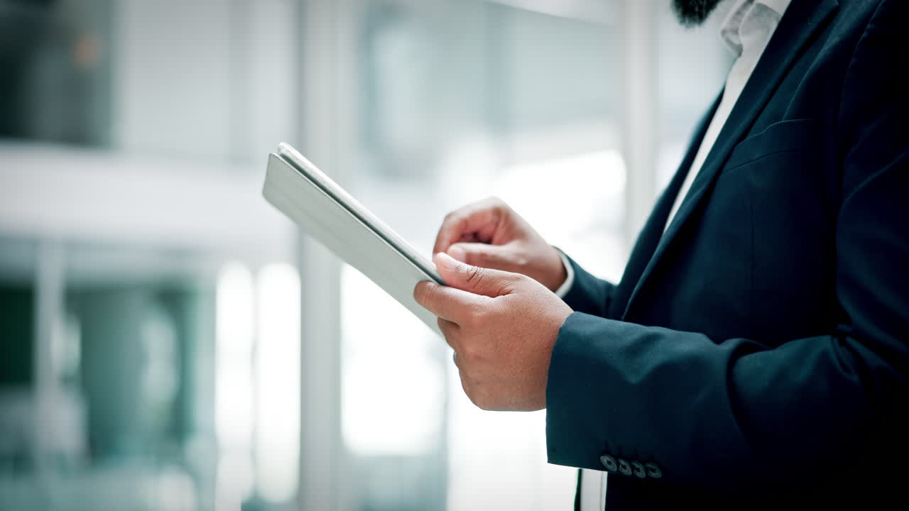 Professional Man Using Digital Tablet in Modern Office