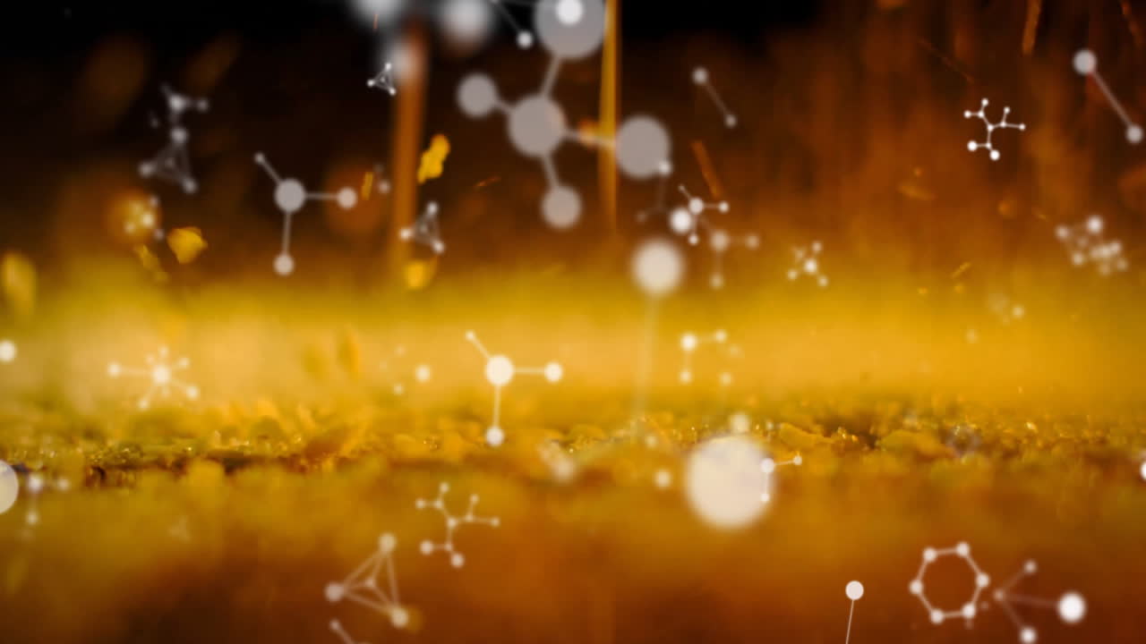 Molecular structures animation over golden liquid background with floating particles