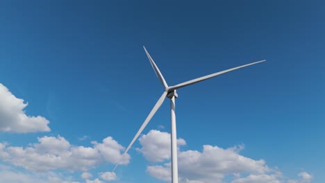 Aerial drone close-up of wind turbine blades spinning under bright blue sky. Showcasing green energy, sustainability and help preventing. climate change