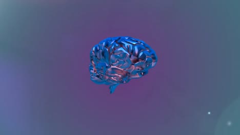 metallic blue human brain spinning against colorful spots on grey background