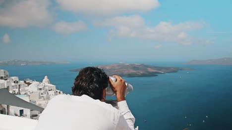 man looking through a viewfinder