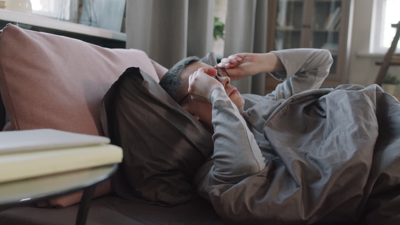 Man Stretching In Bed In Morning