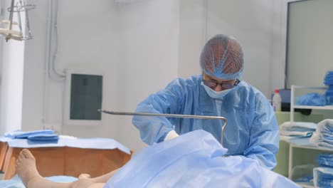professional surgeons during surgery. sick old woman. surgery.